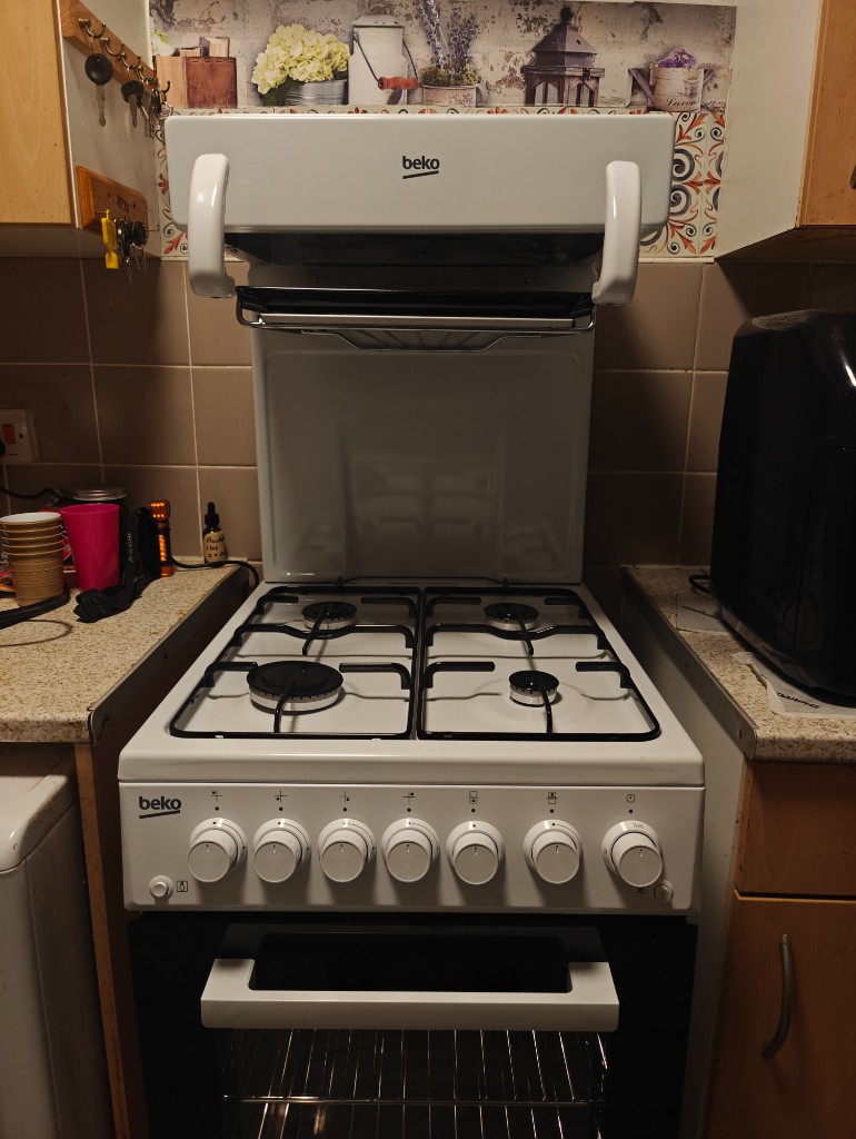 White Beko gas cooker with eye-level grill in a compact kitchen